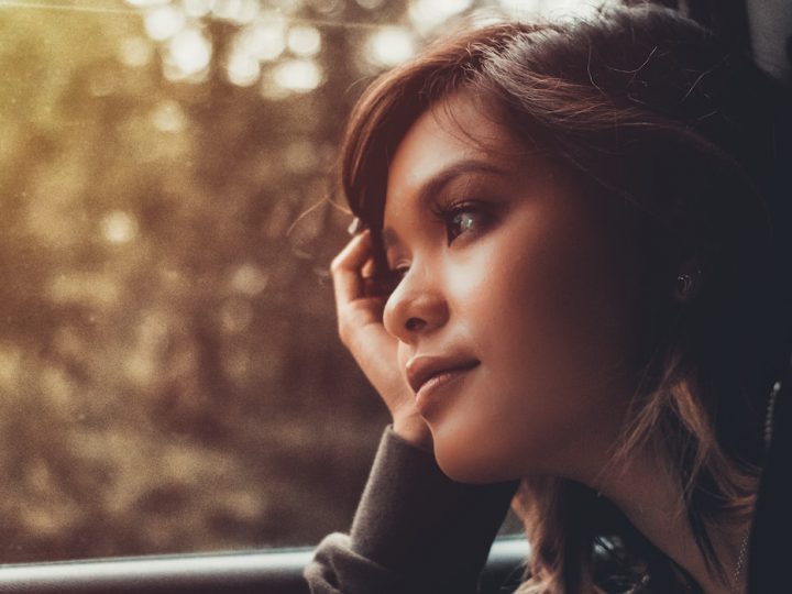 girl Daydreaming while in a car