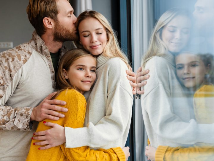 Beautiful-happy-young-family-hugging-and-kissing