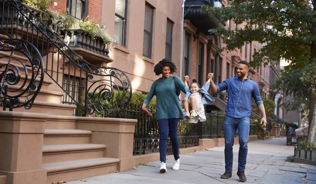 Family taking a walk down the street