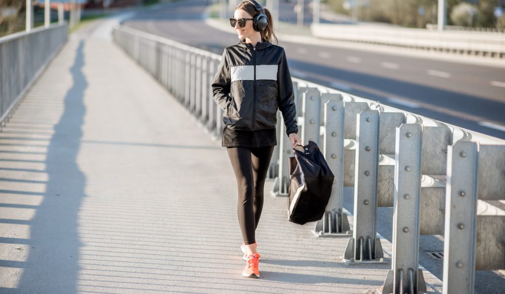 Sports woman walking after the training outdoors 