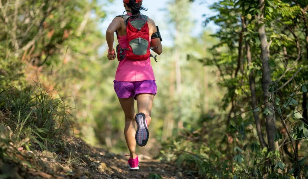 Trail running in forest