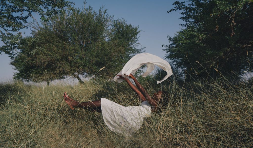 Woman floating in the forest dreaming