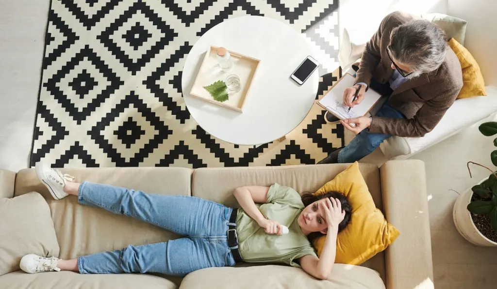 Young Woman On Therapy Session Top View psychoanalysis procedure 