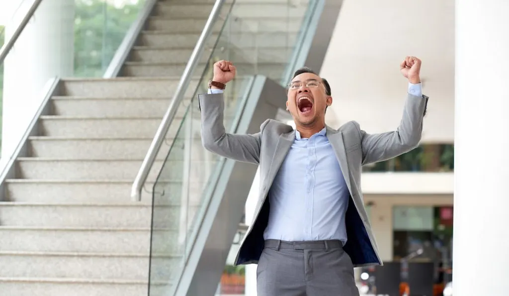 a man celebrating his success