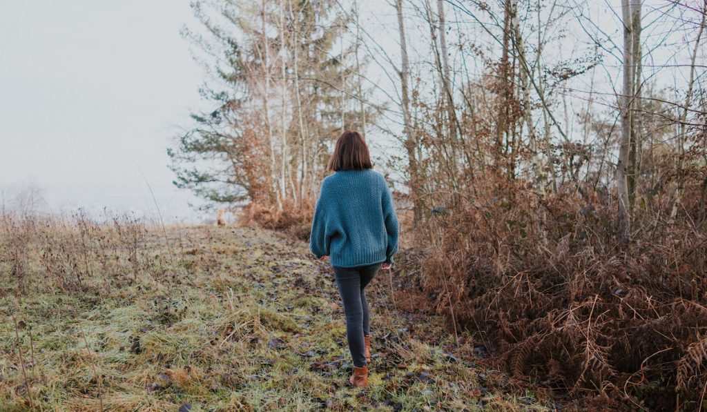 back view of a woman Walking in nature