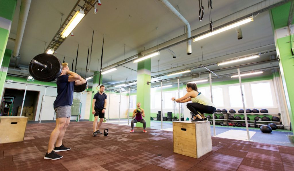 group of people exercising in gym