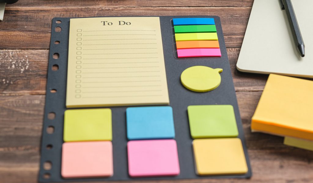 to do list planner on wooden office desk 