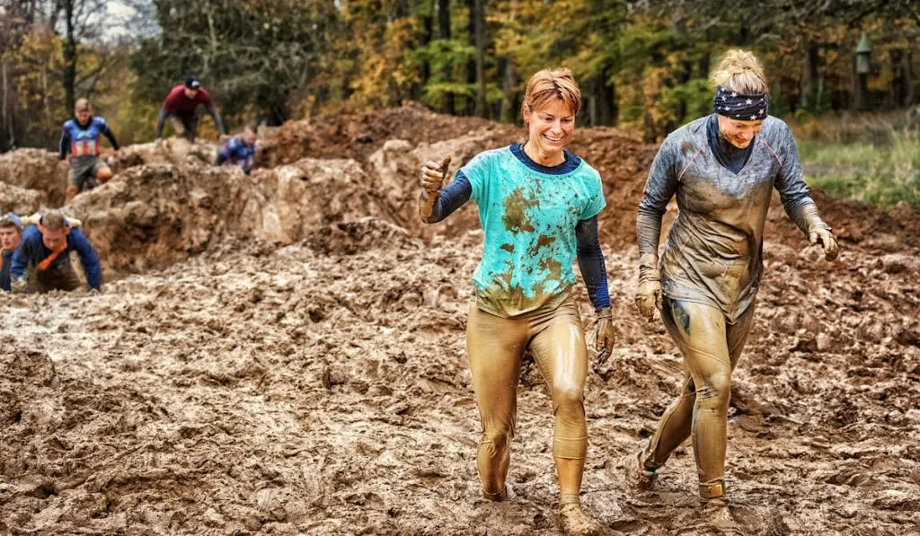 two female doing mud race