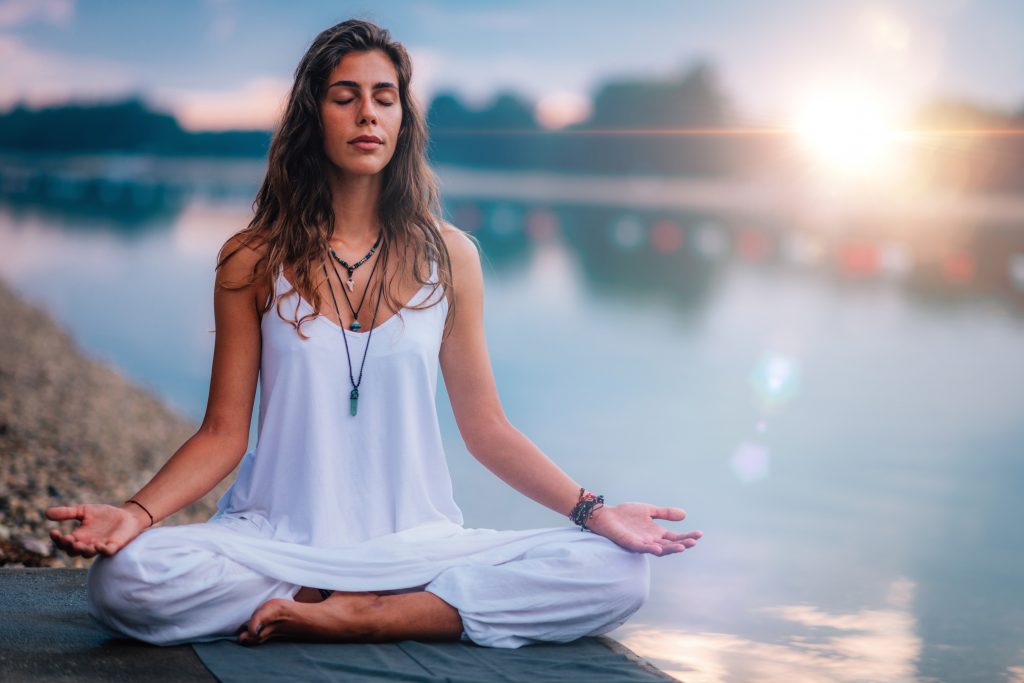 woman doing meditation on lotus position