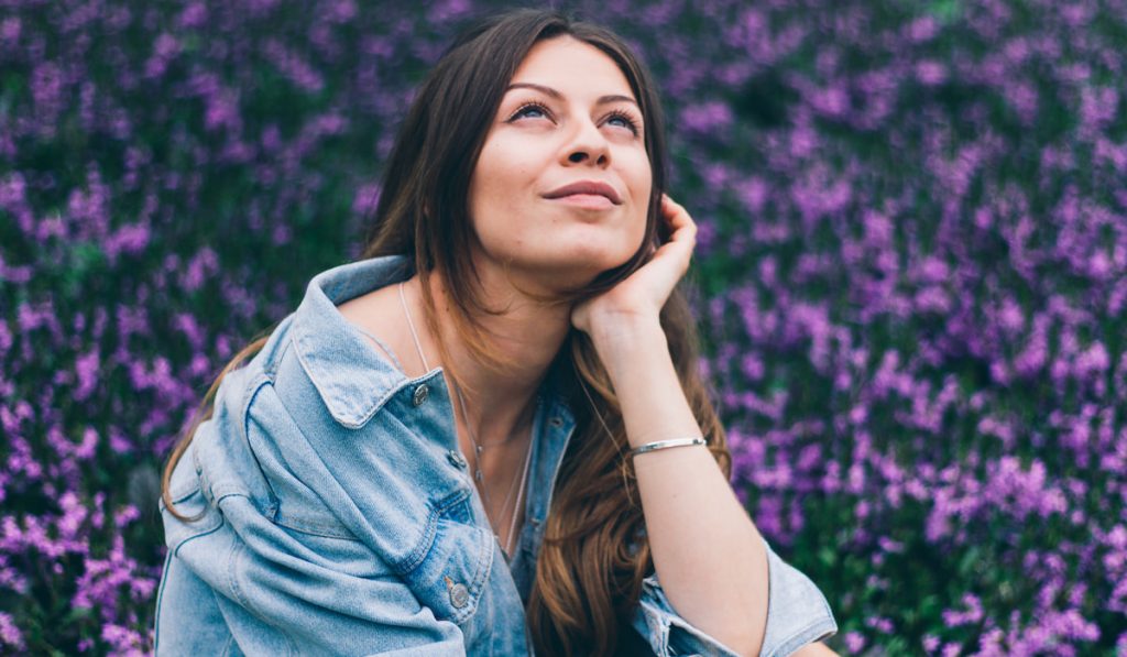 woman in the garden daydreaming 