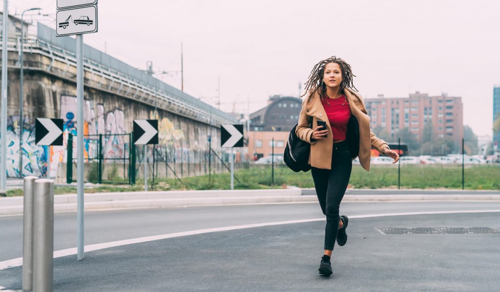 young woman outdoors running