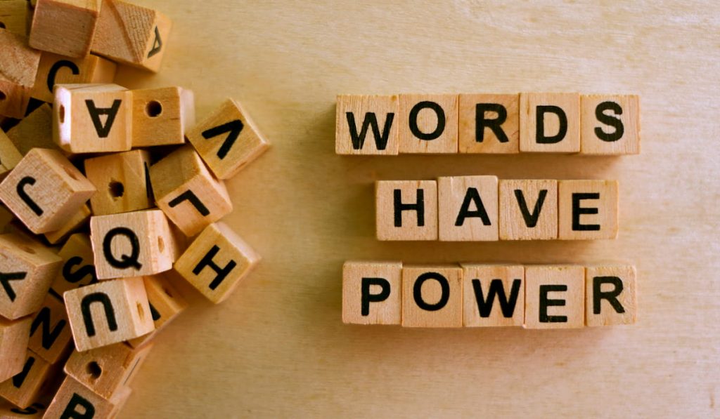 Words Have Power word cube on wood background